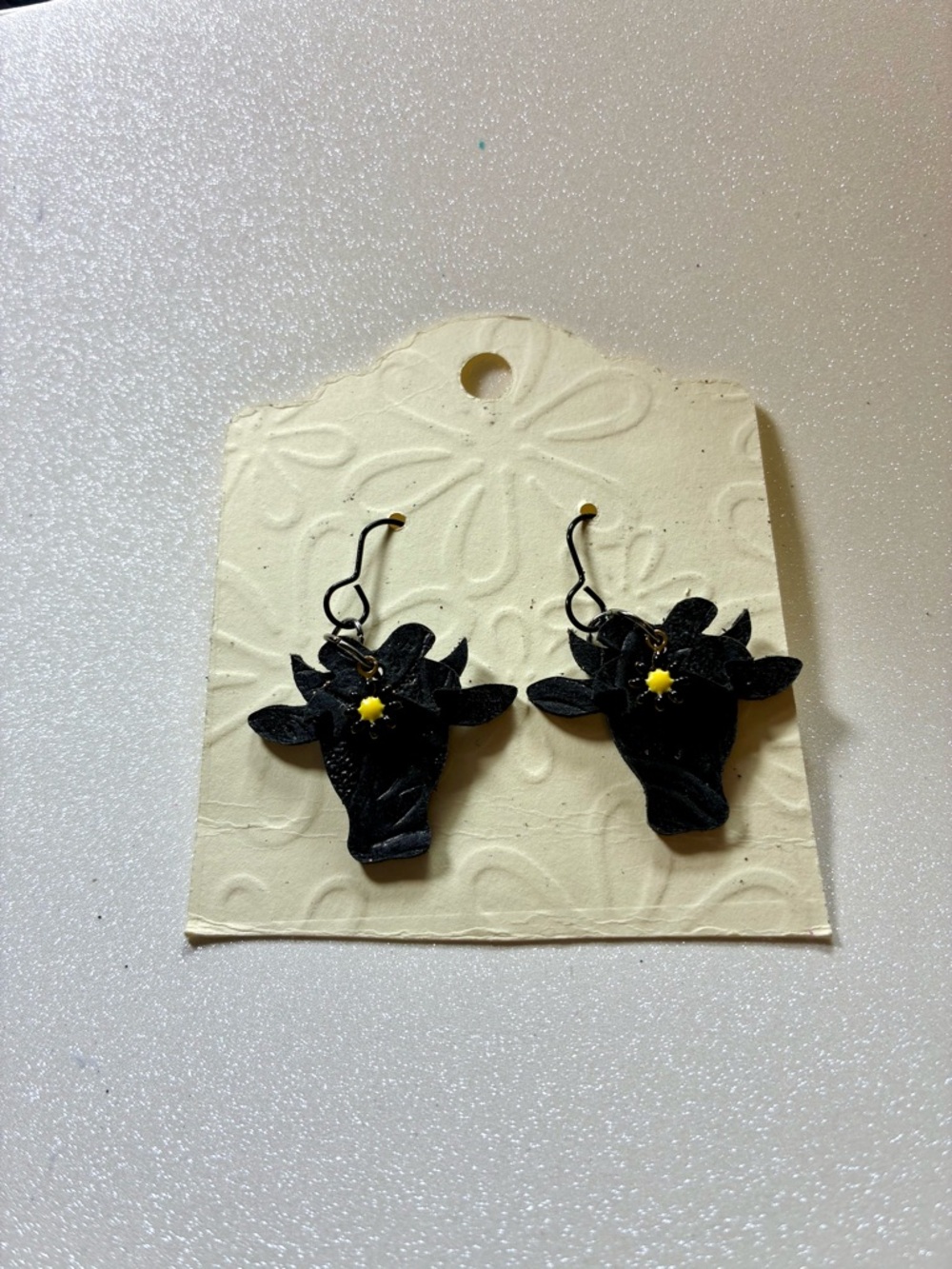 Black Cow Head Dangle Earrings with black and Yellow daisy Accent